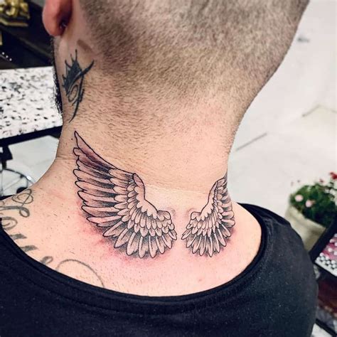 angel wings on neck tattoo